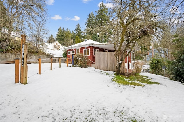 view of yard layered in snow