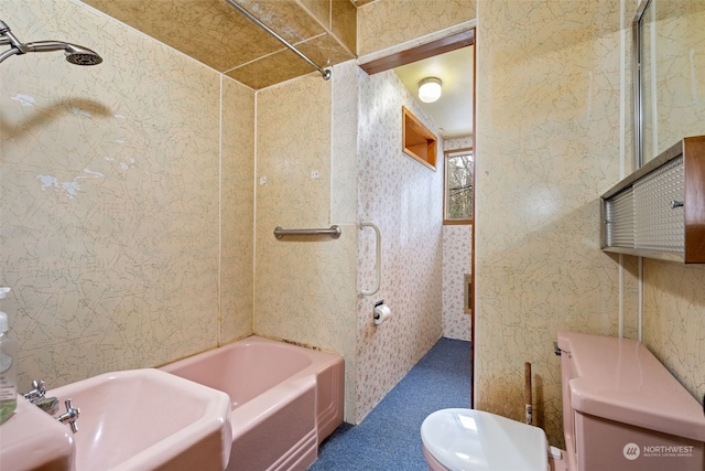 bathroom with shower / bath combination and toilet