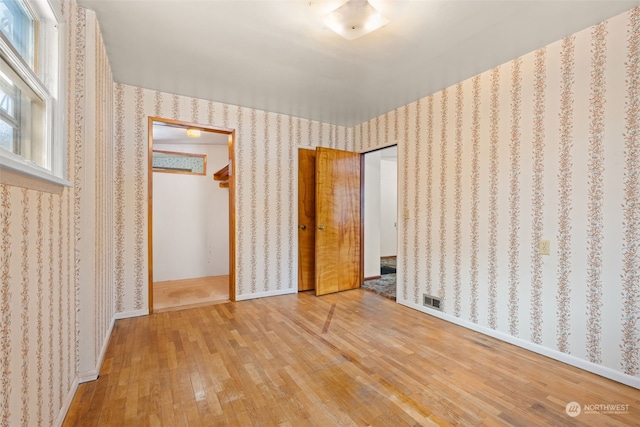 unfurnished bedroom featuring hardwood / wood-style floors