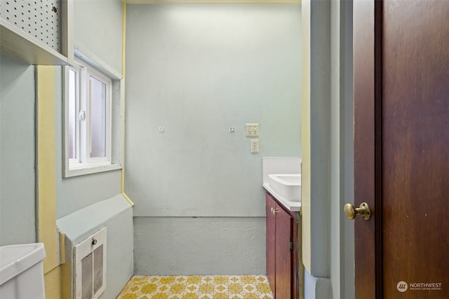 bathroom featuring vanity and toilet