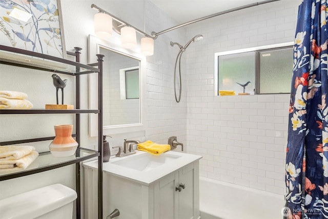 full bathroom with vanity, shower / tub combo, and toilet