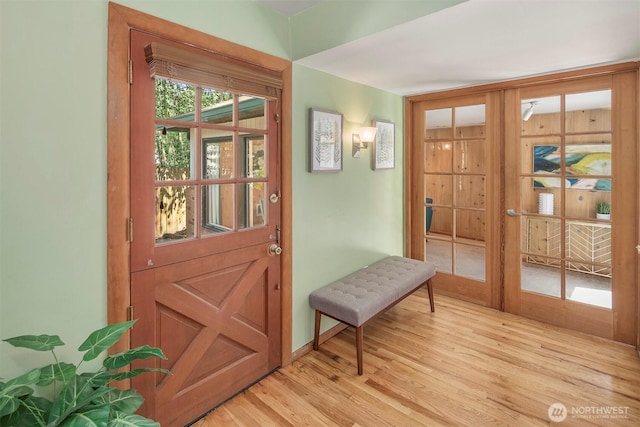 entryway featuring light hardwood / wood-style flooring and french doors