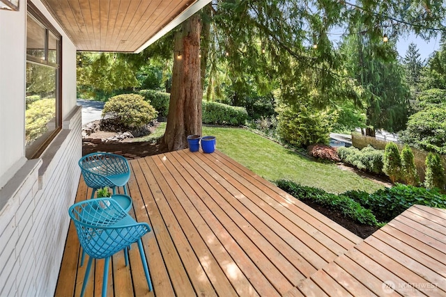 deck featuring a yard