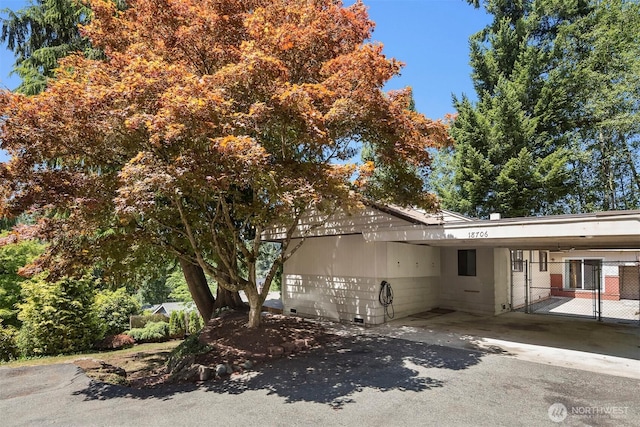 view of home's exterior with a carport