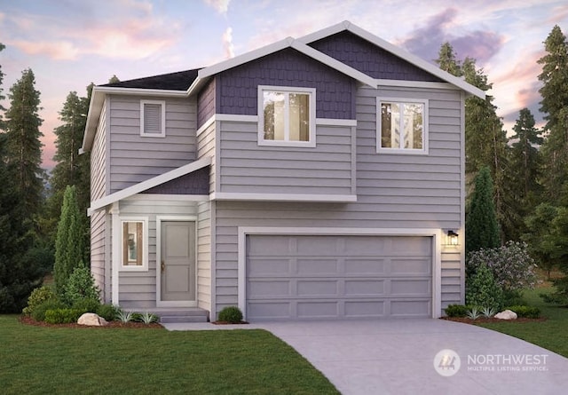 view of front of house with a garage and a yard