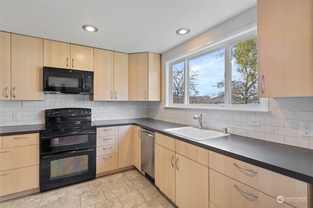 kitchen with tasteful backsplash, sink, light brown cabinets, and black appliances