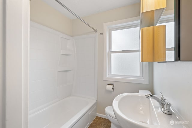 full bathroom featuring sink, shower / bathtub combination, and toilet