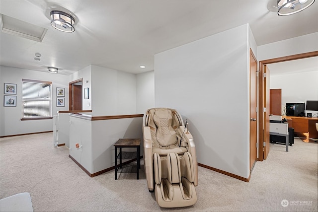 living area with light colored carpet