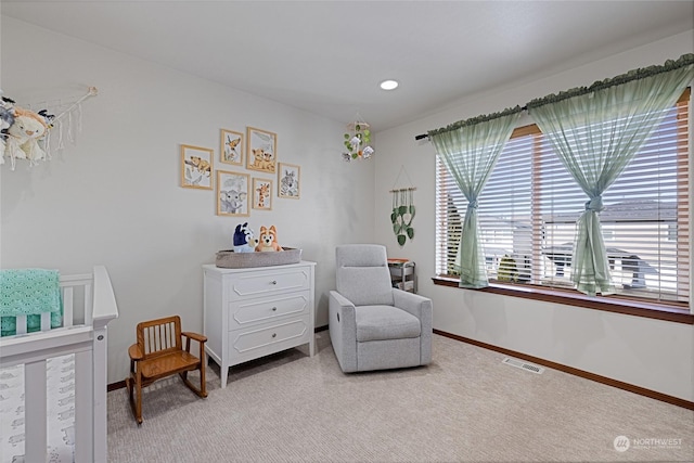 living area with carpet flooring