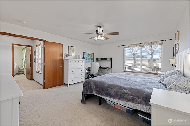 bedroom with light carpet and ceiling fan