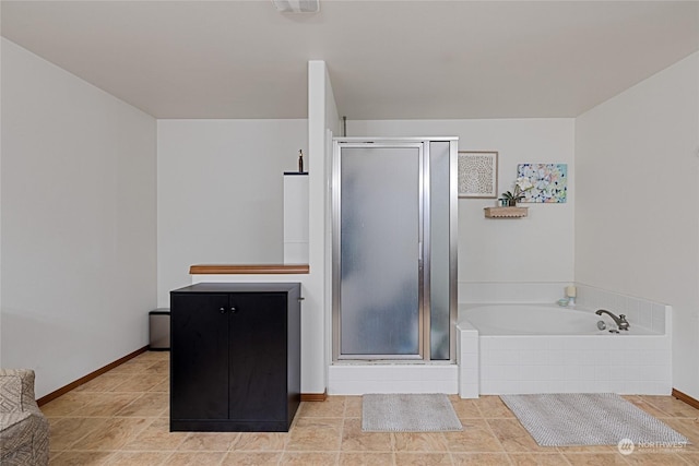 bathroom featuring tile patterned floors and plus walk in shower