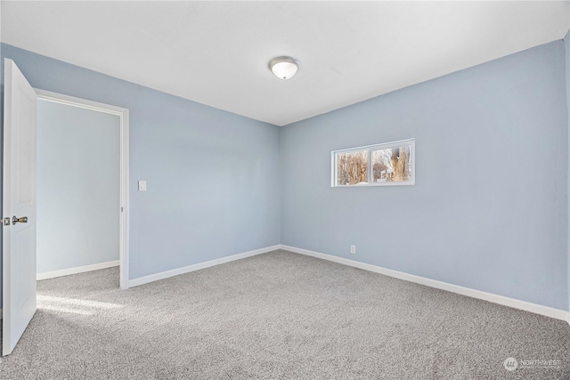 empty room featuring carpet floors