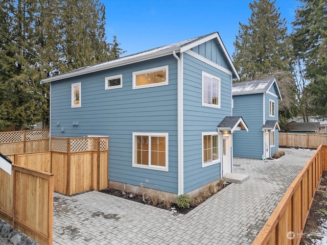 rear view of property featuring a patio area