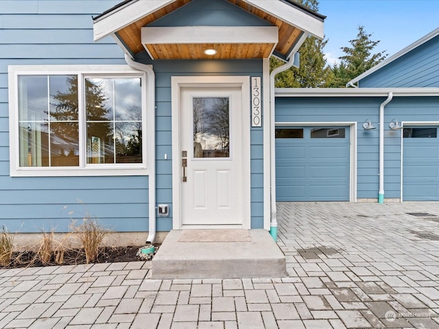 property entrance featuring a garage