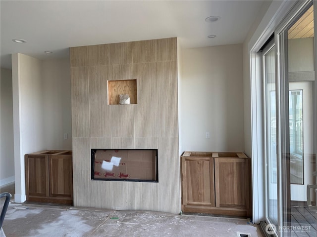 unfurnished living room with a fireplace
