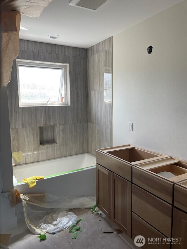 full bathroom with a tub