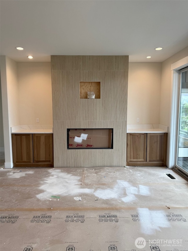 3910 W 3rd St, Anacortes, WA 98221 - unfurnished living room featuring a fireplace and recessed lighting