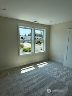 3910 W 3rd St, Anacortes, WA 98221 - carpeted empty room featuring baseboards