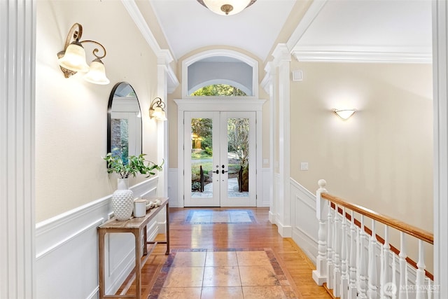 interior space featuring crown molding, tile patterned floors, and french doors