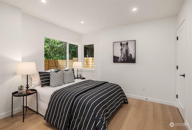 bedroom with light hardwood / wood-style flooring