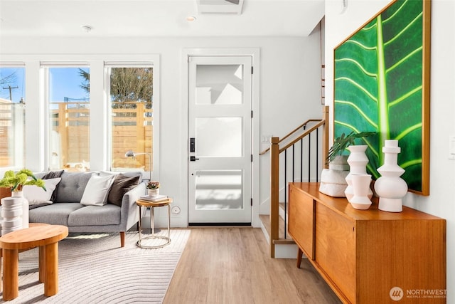 doorway to outside with light wood-type flooring