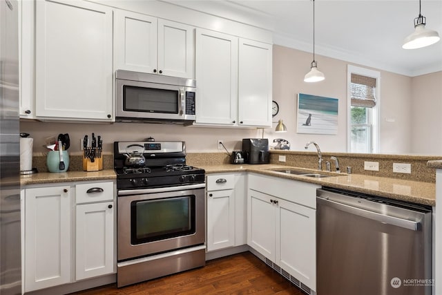 kitchen with stainless steel appliances, sink, and white cabinets