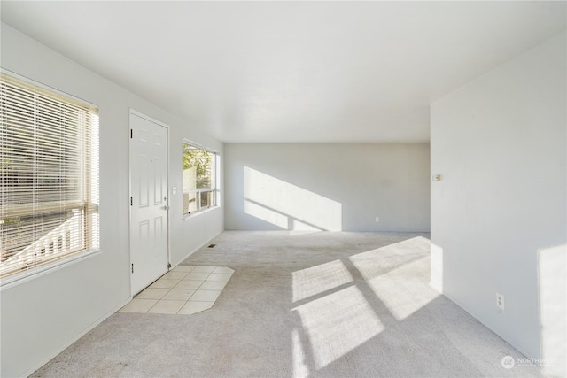 interior space featuring light colored carpet