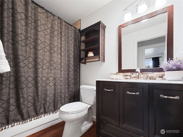 full bathroom with shower / bathtub combination with curtain, backsplash, vanity, wood-type flooring, and toilet