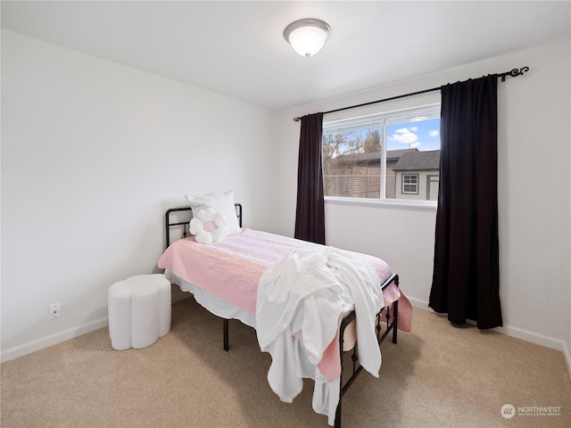 bedroom with light colored carpet