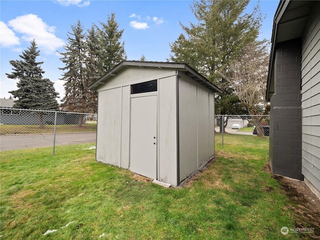 view of outbuilding with a lawn