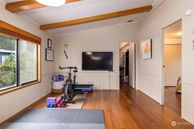 exercise room with light hardwood / wood-style floors