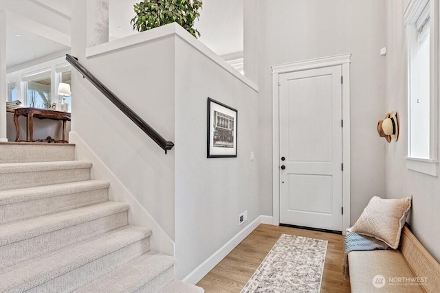 entrance foyer with light hardwood / wood-style flooring and a wealth of natural light