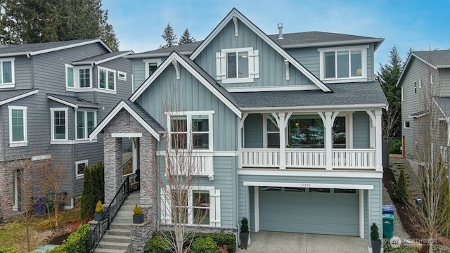 view of front of house featuring a garage and a balcony