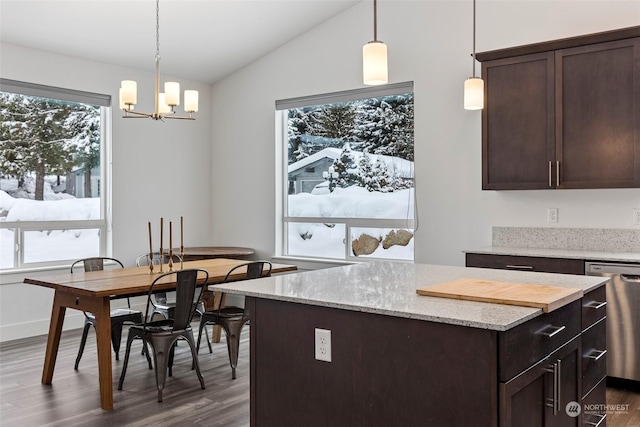 kitchen featuring dark brown cabinetry, dishwasher, hanging light fixtures, and plenty of natural light