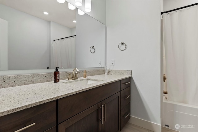 bathroom with vanity and shower / bathtub combination with curtain