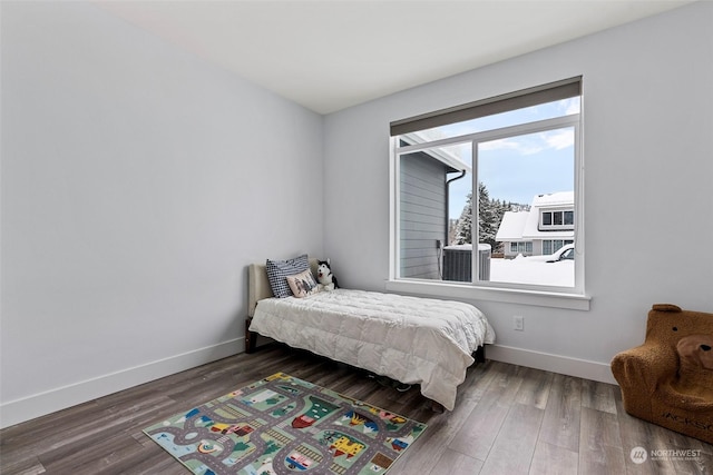 bedroom featuring dark hardwood / wood-style flooring