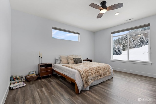 bedroom with ceiling fan and wood-type flooring