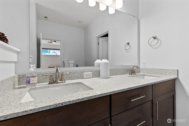 bathroom featuring vanity and ceiling fan