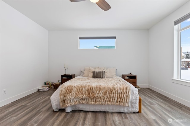 bedroom with ceiling fan and hardwood / wood-style floors