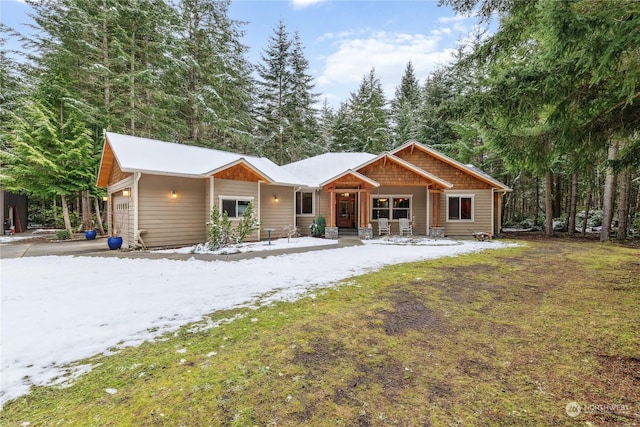 view of front of property featuring a garage and a porch