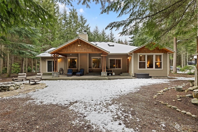 back of house with a patio