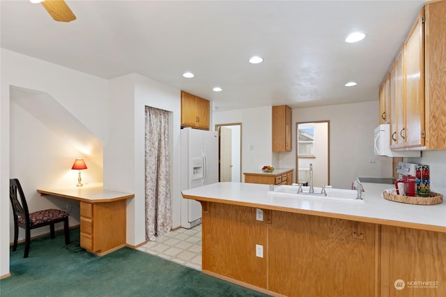 kitchen featuring sink, a kitchen bar, white refrigerator with ice dispenser, stove, and kitchen peninsula