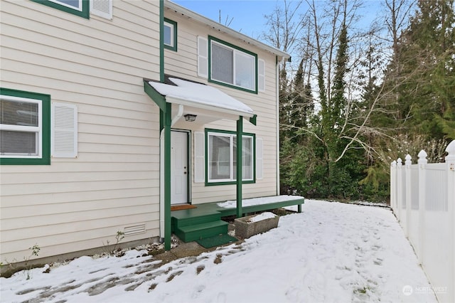 view of snow covered property