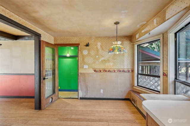 unfurnished dining area with light hardwood / wood-style flooring