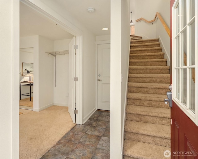 stairway with carpet floors