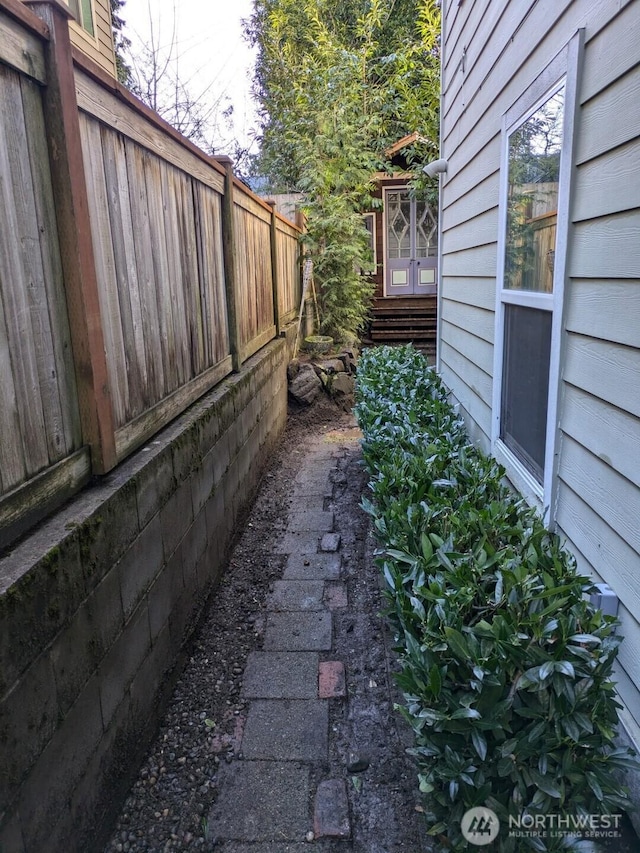 view of home's exterior featuring fence