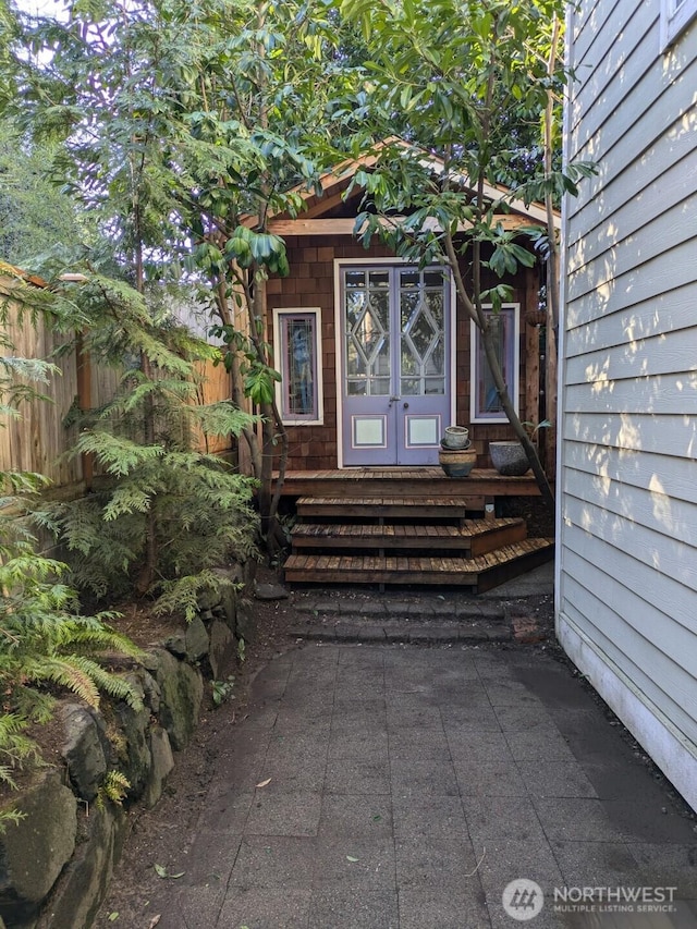 doorway to property with fence