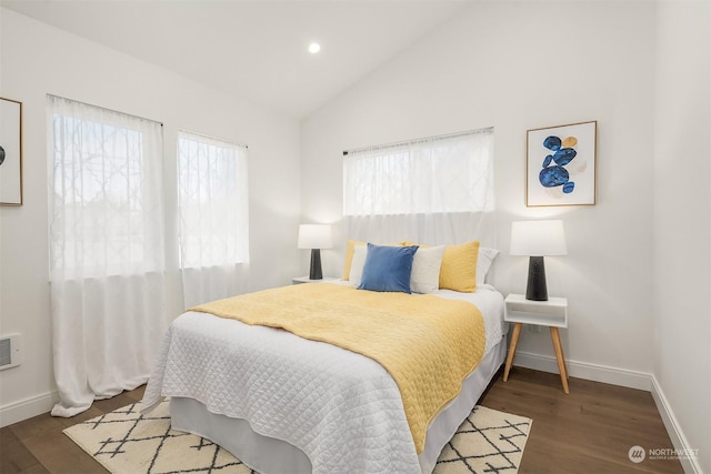 bedroom featuring lofted ceiling and dark hardwood / wood-style floors