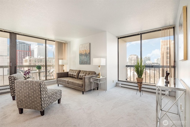 living area featuring floor to ceiling windows, a city view, a textured ceiling, and carpet flooring
