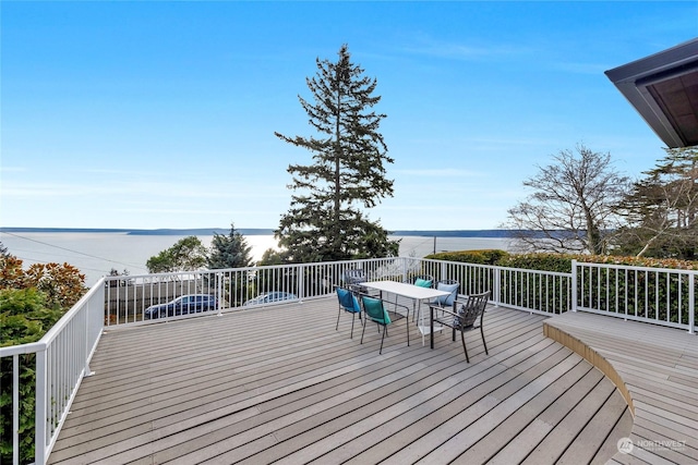 wooden deck featuring a water view